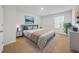 Comfortable bedroom with a large bed, dresser, nightstands and natural light at 13699 Inman Rd, Hampton, GA 30228