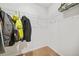 Walk-in closet featuring carpeted flooring and wire shelving with hanging coats at 13699 Inman Rd, Hampton, GA 30228