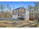 Lovely home boasts a two-car garage, inviting porch, and spacious front yard at 13699 Inman Rd, Hampton, GA 30228