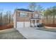 Beautiful brick home boasts a two-car garage, welcoming porch, and well-maintained landscaping at 13699 Inman Rd, Hampton, GA 30228