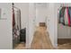 Hallway with wood flooring with two closets on the left and one on the right at 13699 Inman Rd, Hampton, GA 30228