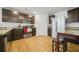 Modern kitchen featuring stainless steel appliances, dark cabinets, and a wood floor at 13699 Inman Rd, Hampton, GA 30228