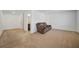 Upstairs living room with a couch and entry to bathroom at 13699 Inman Rd, Hampton, GA 30228