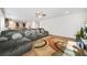 Spacious living area with large sectional sofa and wood-look flooring at 13699 Inman Rd, Hampton, GA 30228