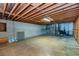 Unfinished basement with exposed ceiling, concrete walls and utility hookups at 166 Muse Rd, Fayetteville, GA 30214