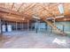 Unfinished basement with exposed ceiling joists and stairs at 166 Muse Rd, Fayetteville, GA 30214