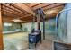 Unfinished basement with an old-fashioned stove and windows at 166 Muse Rd, Fayetteville, GA 30214