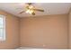Bedroom featuring neutral-colored walls and carpet floors, and overhead fan fixture at 166 Muse Rd, Fayetteville, GA 30214