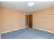 Bedroom featuring door, a window, and blue carpeting at 166 Muse Rd, Fayetteville, GA 30214