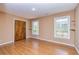 Bedroom featuring laminate flooring and two windows at 166 Muse Rd, Fayetteville, GA 30214