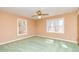 Bedroom featuring two windows and green carpeting at 166 Muse Rd, Fayetteville, GA 30214