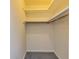 Small walk-in closet with shelving and carpeting at 166 Muse Rd, Fayetteville, GA 30214
