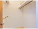Walk-in closet features a small window and multiple rows of hanging storage and overhead shelves at 166 Muse Rd, Fayetteville, GA 30214