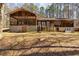 Rear exterior of home with screened porch, stairs and basement entrance at 166 Muse Rd, Fayetteville, GA 30214