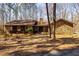 Charming stone and wood home featuring a stone chimney and double door entrance at 166 Muse Rd, Fayetteville, GA 30214