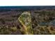 Land outlined with the lot boundaries surrounded by lush trees, creating a private and peaceful setting by the water at 166 Muse Rd, Fayetteville, GA 30214