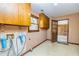 The laundry room includes utility sink, hanging cabinets, and outdoor access at 166 Muse Rd, Fayetteville, GA 30214