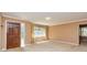 Living room with large picture window, carpet and front door at 166 Muse Rd, Fayetteville, GA 30214