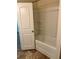 Clean bathroom features a built-in shower with shelving at 2056 Belmont Cir, Conyers, GA 30012