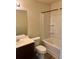 A clean bathroom features a toilet, vanity, and a shower with shelving at 2056 Belmont Cir, Conyers, GA 30012
