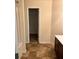 Bathroom featuring tile floors and a walk-in closet for ample storage at 2056 Belmont Cir, Conyers, GA 30012
