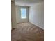 A large bedroom is brightened by a single window at 2056 Belmont Cir, Conyers, GA 30012