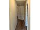 A clean hallway has neutral carpeting and a ceiling access panel at 2056 Belmont Cir, Conyers, GA 30012