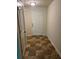 Entryway featuring a textured tile floor, white door, and a closet, with light walls and ceiling at 2056 Belmont Cir, Conyers, GA 30012