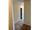 Spacious hallway with neutral walls and carpeting leads to other rooms at 2056 Belmont Cir, Conyers, GA 30012