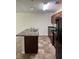 Functional kitchen features an island with a sink and black appliances at 2056 Belmont Cir, Conyers, GA 30012