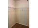 A standard walk-in closet features wire shelving around the corners at 2056 Belmont Cir, Conyers, GA 30012