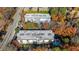Overhead view showcases two residential buildings surrounded by vibrant fall foliage, with a swimming pool visible at 3201 Lenox Ne Rd # 23, Atlanta, GA 30324