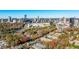 Scenic aerial view showing residential buildings in a leafy neighborhood with the city skyline in the distance at 3201 Lenox Ne Rd # 23, Atlanta, GA 30324