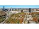 Aerial view of the condo building in the surrounding community and Atlanta's skyline beyond at 3201 Lenox Ne Rd # 23, Atlanta, GA 30324