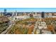 Aerial view of the condo building in the surrounding community and Atlanta's skyline beyond at 3201 Lenox Ne Rd # 23, Atlanta, GA 30324