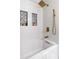 Bright bathroom showcases a white tub with gold fixtures and patterned tile inlays at 3201 Lenox Ne Rd # 23, Atlanta, GA 30324