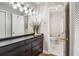Bathroom vanity features a long black dresser and doorway to the toilet and shower at 3201 Lenox Ne Rd # 23, Atlanta, GA 30324