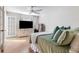 Well-lit bedroom with hardwood flooring, closet and large television at 3201 Lenox Ne Rd # 23, Atlanta, GA 30324