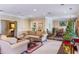 Bright living room featuring a fireplace, comfortable seating and Christmas decor at 3201 Lenox Ne Rd # 23, Atlanta, GA 30324