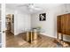 Office with hardwood floors, white walls, glass table and storage at 3201 Lenox Ne Rd # 23, Atlanta, GA 30324