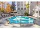 Outdoor pool is surrounded by lounge chairs and lush landscaping at 3201 Lenox Ne Rd # 23, Atlanta, GA 30324