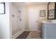 Bathroom featuring tiled walk-in shower, modern vanity, and neutral decor, providing a clean and functional space at 1256 Elizabeth Sw Ave, Atlanta, GA 30310
