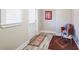 A bright foyer area featuring luxury vinyl floors, a window, and a sitting area at 1256 Elizabeth Sw Ave, Atlanta, GA 30310