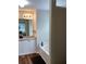 Well-lit bathroom featuring modern vanity with countertop and a soaking tub for relaxation at 2546 Tullamore Cir, Snellville, GA 30039