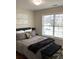 Cozy bedroom featuring a comfortable bed, modern decor, and large window for natural light at 2546 Tullamore Cir, Snellville, GA 30039