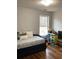 Bright bedroom with a cozy bed, toy storage, and a large window offering great views at 2546 Tullamore Cir, Snellville, GA 30039