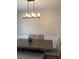 Bright dining room features a classic chandelier and wainscoting at 2546 Tullamore Cir, Snellville, GA 30039
