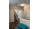 Spacious hallway featuring a blue table, hardwood floors, and staircase at 2546 Tullamore Cir, Snellville, GA 30039