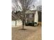 Attractive home with vinyl siding and brick accents, complemented by a well-kept lawn and mature trees at 2546 Tullamore Cir, Snellville, GA 30039