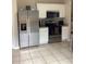 Kitchen featuring stainless steel appliances, tile flooring, and ample counter space at 2546 Tullamore Cir, Snellville, GA 30039